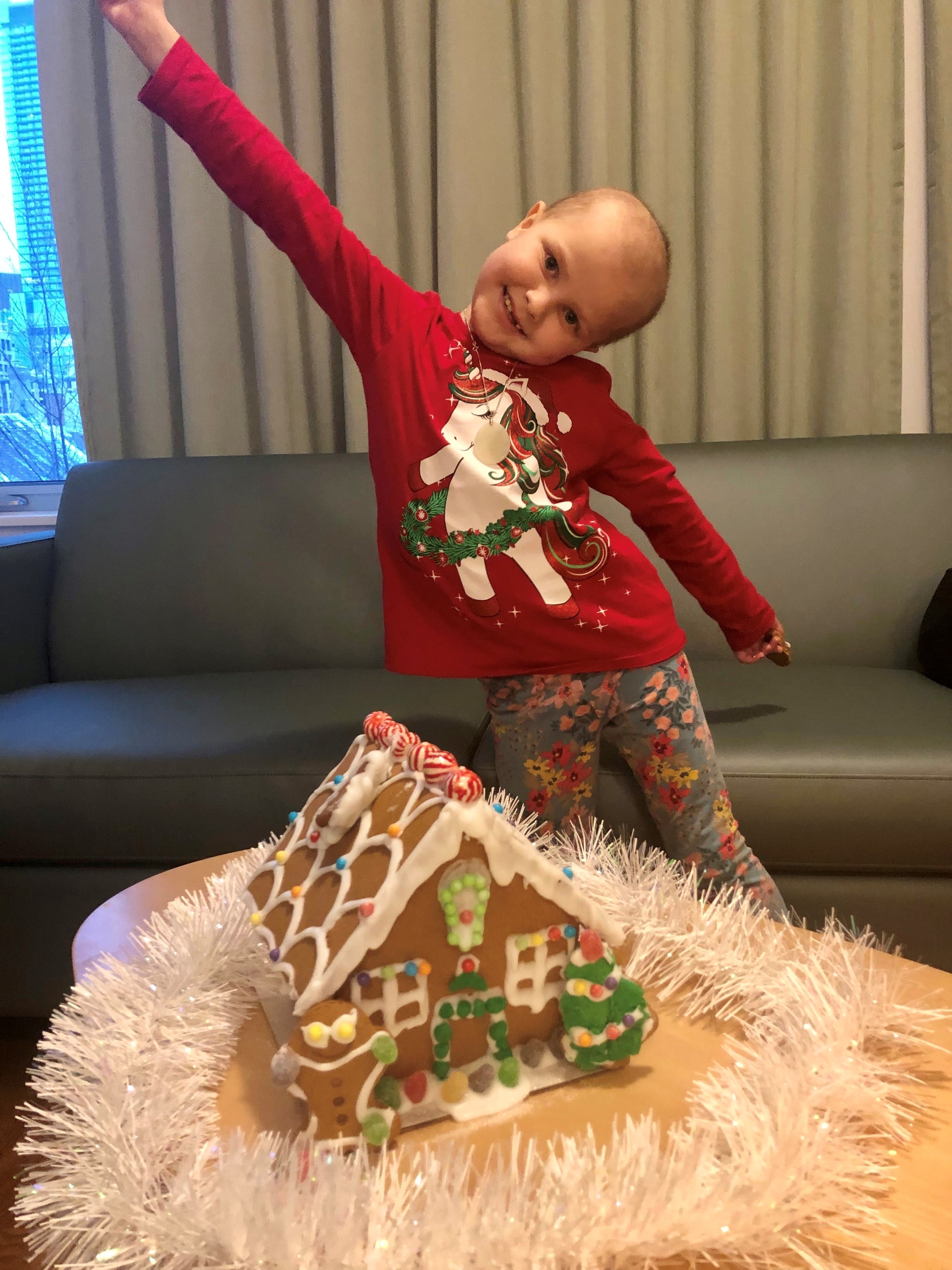 Emiliya with her gingerbread house